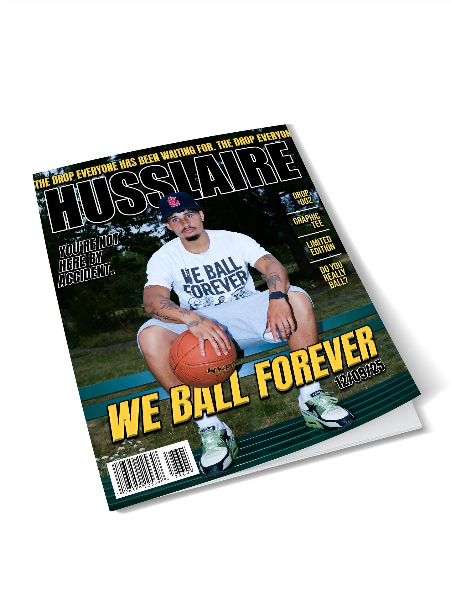 Mockup of a HUSSLAIRE magazine cover reading WE BALL FOREVER, with a man holding a basketball on a bench